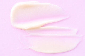 Cosmetic cream close-up. Macro photo. The concept of cosmetic products, skin and hair care, beauty and health. Background image in trendy pink.