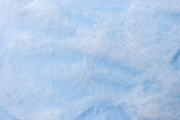 Closeup transparent foaming cosmetic gel. The concept of face and body care, cosmetology, beauty and health. Abstract background image.