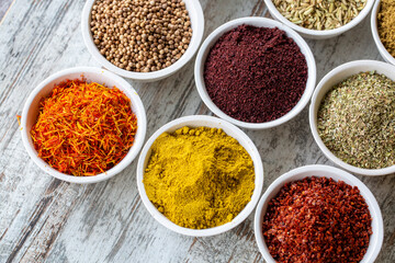 Colorful spices and herbs isolated on cooking background and design