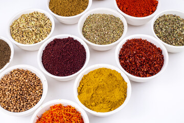 Colorful spices and herbs isolated on cooking background and design