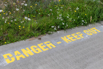 Text Danger Keep Out at an airport.