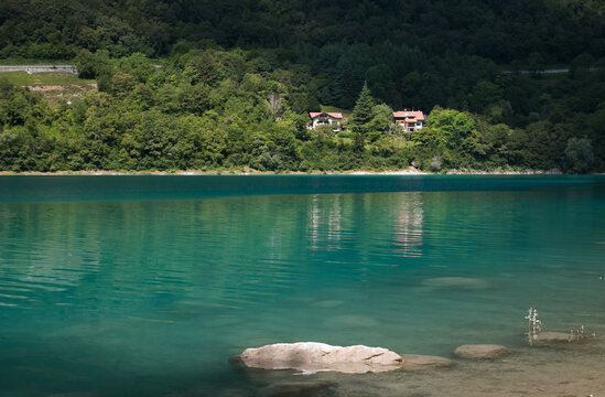 Beautiful view of Tenno alpine lake with turquoise water in Trentino Alto-Adige