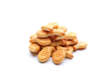 Delicious crispy goldfish crackers on white background