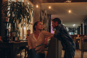 man and woman in cafe