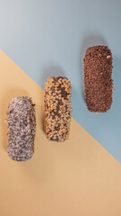 Three chocolate desserts on a double background of blue and yellow colors.