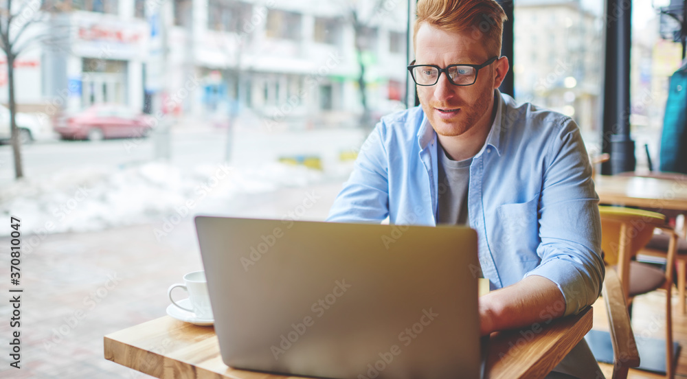 Aufkleber skilled caucasian blogger typing text for next publication in social network analyzing statistics of
