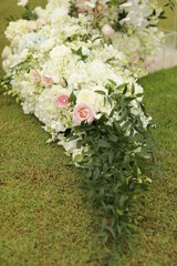 Wedding arch, chairs for guests, wedding accessories and decorations. Wedding ceremony. Beautiful wedding setup.