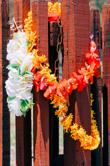 Floral wreath around fence