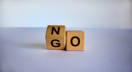 Turning cube and changed the word 'go' to 'no'. Beautiful white background. Business concept. Copy space.