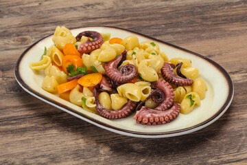 Pasta with octopus and yellow tomatoes