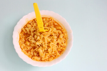 Traditional asian noodle soup, Fresh noodles on bowl, Instant noodles top view. Asian ramen noodles in black bowl on the table. Asian noodle soup 