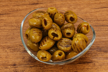 Green grilled olives in the bowl