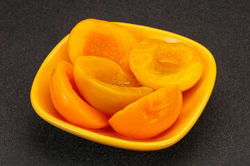 Marinated peaches fruit in the bowl
