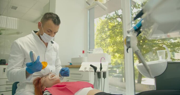 Dental curing light used for teeth treatment, modern equipment, process