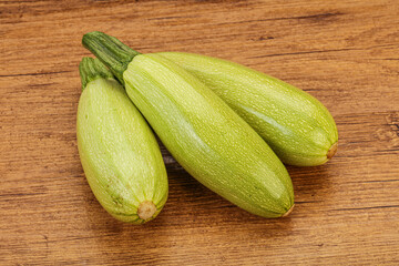 Young tasty zucchini over board