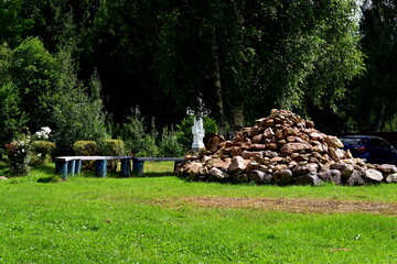 a pile of stones, benches in the park
