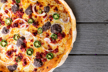 Mexican pizza on a wooden table