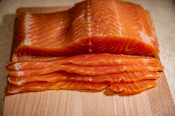 Close-up slices of fresh salmon fillet. salmon fillet on a cutting board.