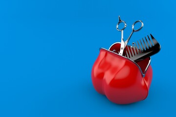 Barber scissors inside red purse