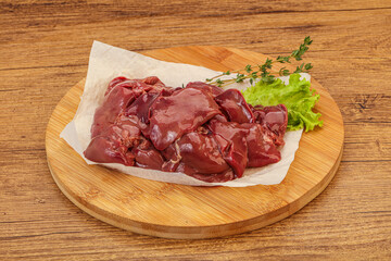 Raw chicken liver over board