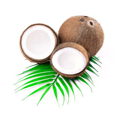 Fototapeta na wymiar Coconut with coconut palm leaves isolated on white background. Fresh raw organic half coconut. Healthy food, skin care concept. Vegan food