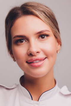 Portrait Young Female Pharmacist On White Background.