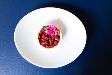 Raspberry tart in a plate, top view