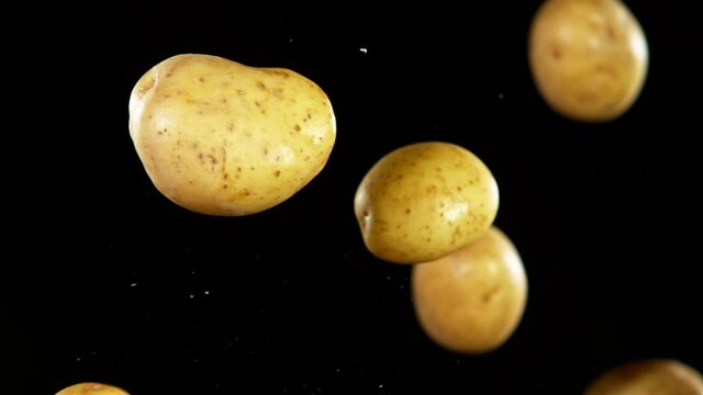 Super Slow Motion Shot of Flying Potatoes, Collision in the Air at 1000fps.