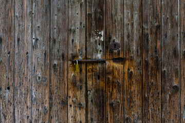 Old wooden door texture with a lock