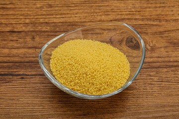 Raw cous cous heap in the bowl