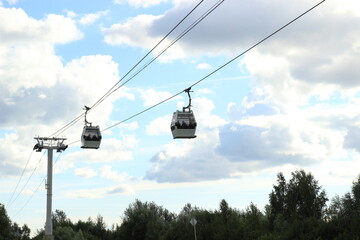 two Cabs cable car against the blue sky with clouds