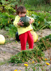 little girl with a pumpkin
