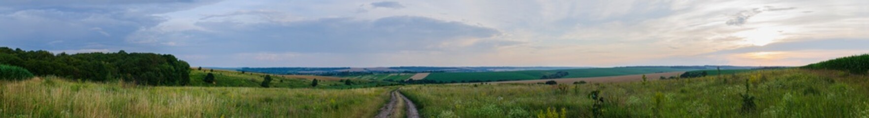 Fototapeta na wymiar field and road - large horizontal panorama landscape