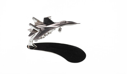 silver model of fighter plane isolated on white background