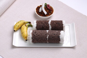 Ragi Puttu or Finger Millet  steamed cake with bengal gram curry