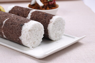 Ragi Puttu or Finger Millet  steamed cake with bengal gram curry