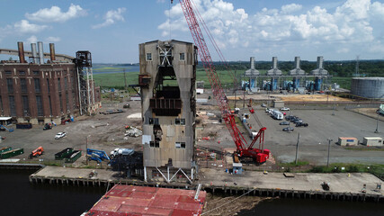 Aerial view of crane dismantling part of old power plant in Sayreville, NJ