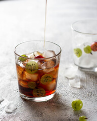 Refreshing cola and gooseberry drink