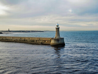 Lighthouse at the end of the pier of Newcastle Harbor on the River Tyne, UK