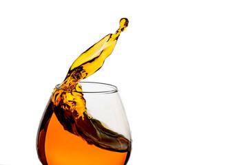 Freeze Action Photography .Splash of Cognac In glass Isolated on White.
