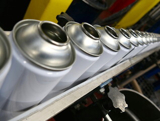 Empty steel aerosol cans in factory