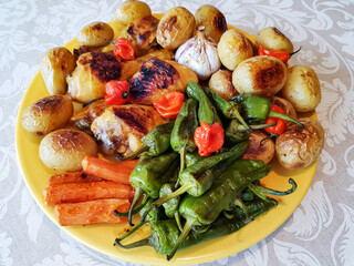 Grilled seasonal vegetables on a yellow platter