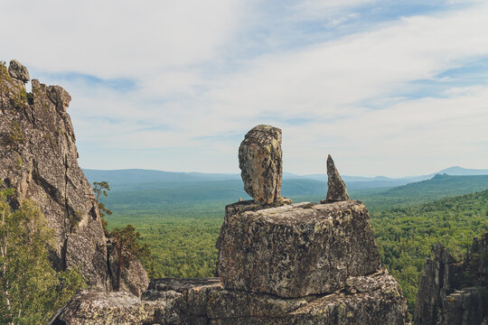 Rocks of Aigir in the smoke of a forest fire. Bashkortostan.