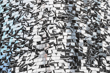 Mosaic of mirror pieces with reflection. Abstract mirror background made up of mirror fragments