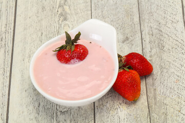 Yoghurt with strawberry in the bowl