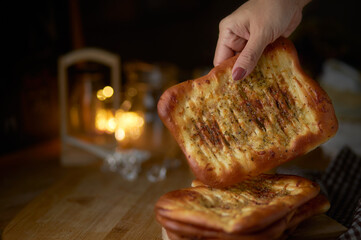 Stacking of spicy naan bread on table