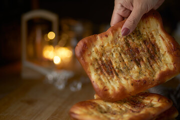 Stacking of spicy naan bread on table