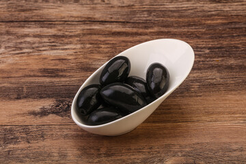 Pickled black olives in the bowl