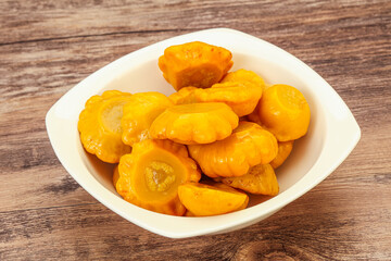 Marinated yellow patisson in the bowl
