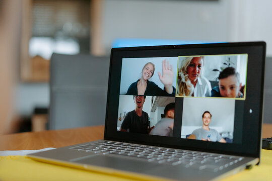 Video conference call with relatives via modern netbook while spending quarantine at home